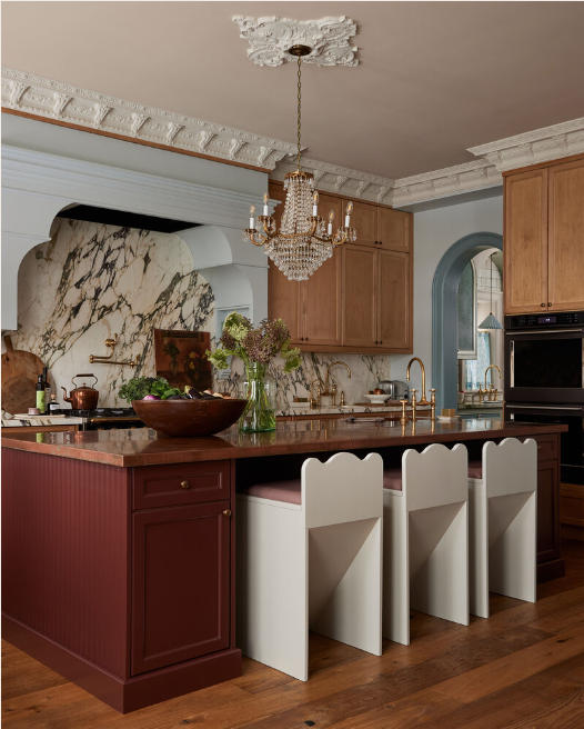Ashley Montgomery Designed kitchen with blue, wood, red and gold tones. 