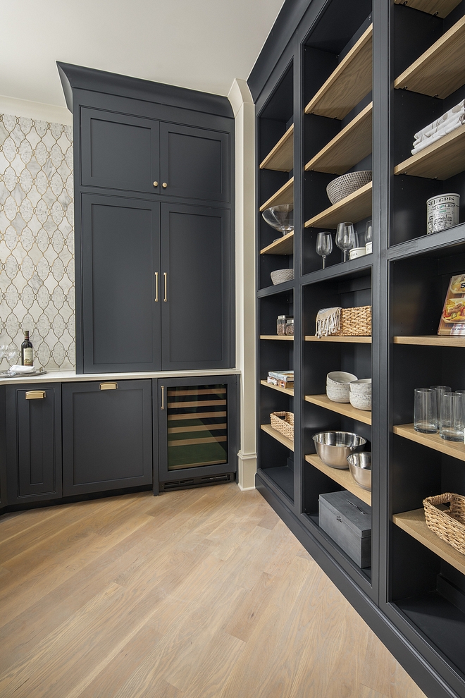 In the kitchen the shelving unit takes up one whole wall and is painted black Satin.