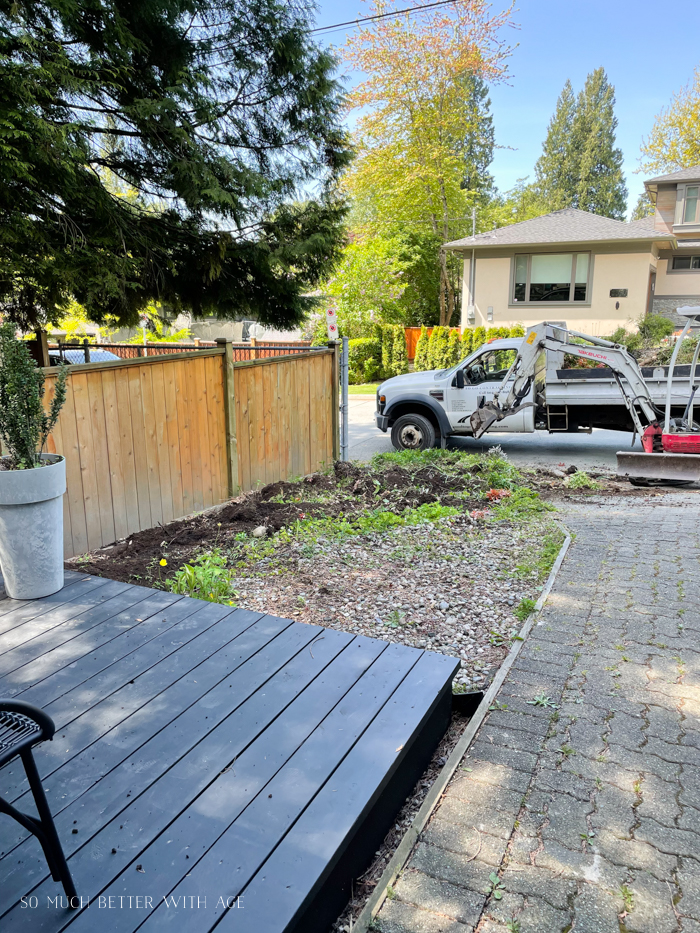 Excavator removed shrubs from front yard.