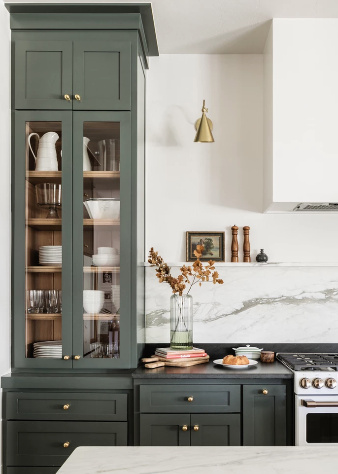 Green kitchen from Kelsey Leigh Design Co. with marble backsplash, Ripe Olive and Pewter Green by Sherwin Wiliams.  