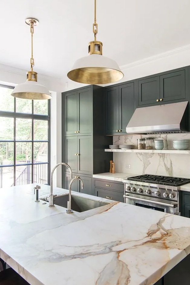 Green kitchen cabinets and marble countertop by Elizabeth Roberts. 