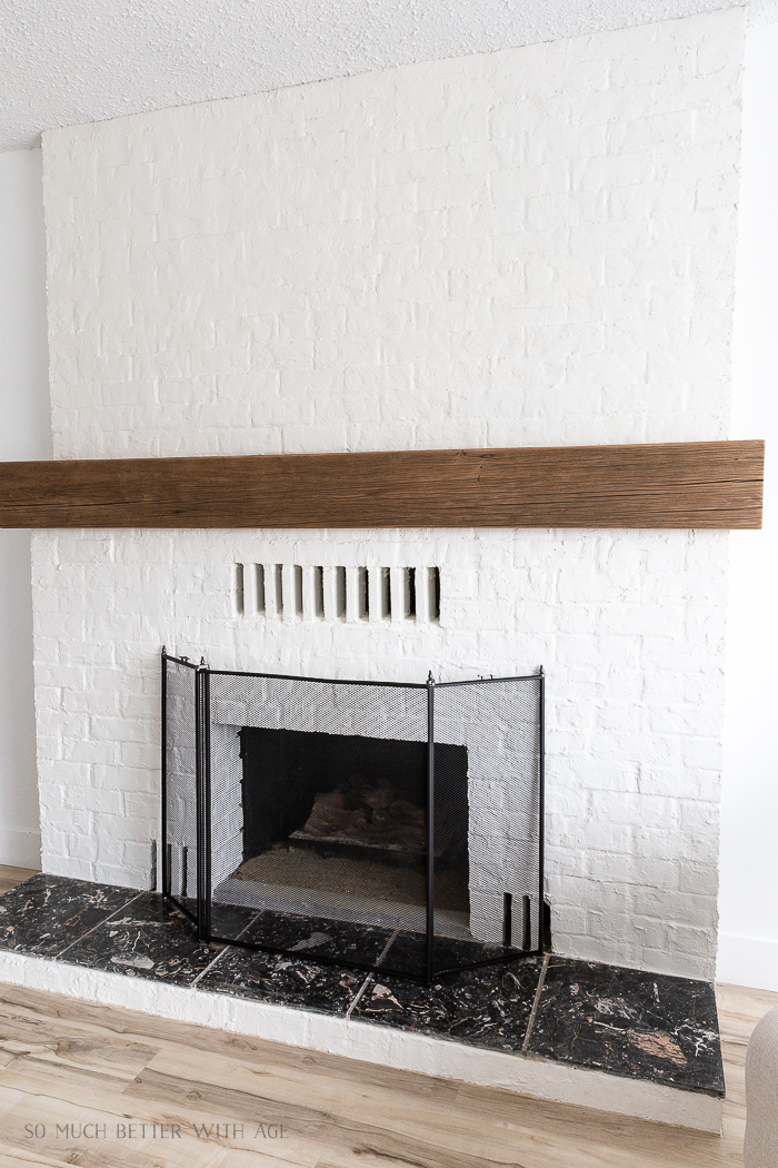 Fireplace with barnwood mantel. 