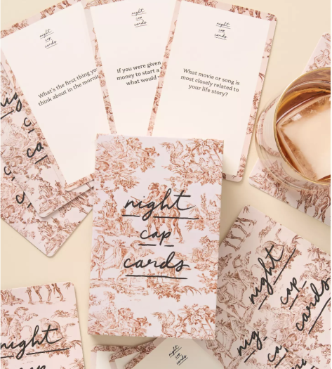 Friend of Mine conversation starters cards that are in pink toile with pretty script handwriting. 