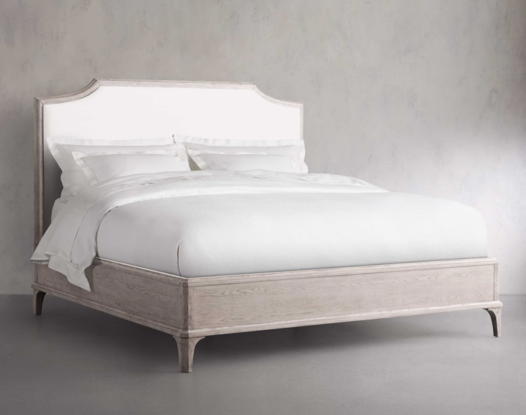 St. Martin wooden and upholstered French style bed from Arhaus. 