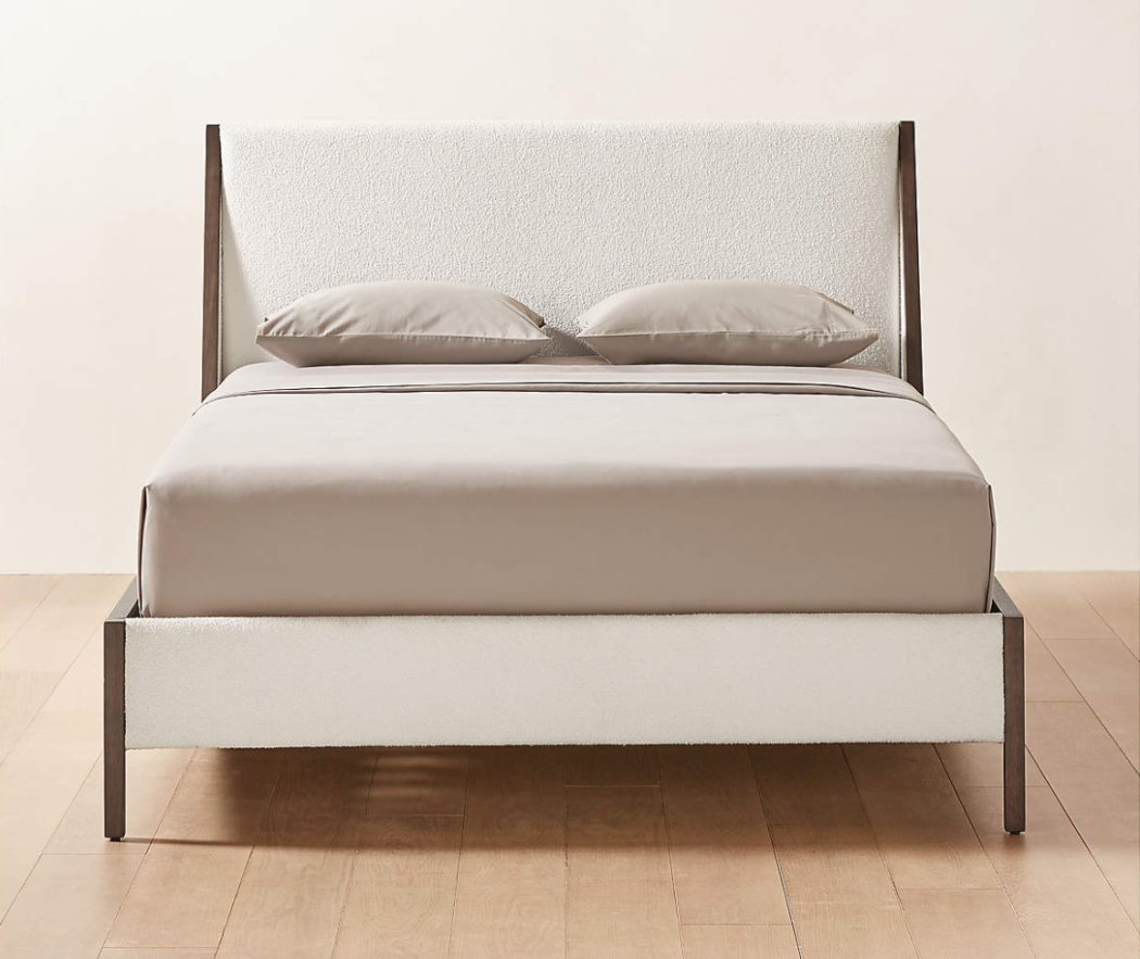 Malena upholstered and wooden bed from CB2. 