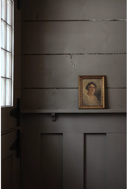 Urbane Bronze by  Sherwin Williams painted on rustic wall. 