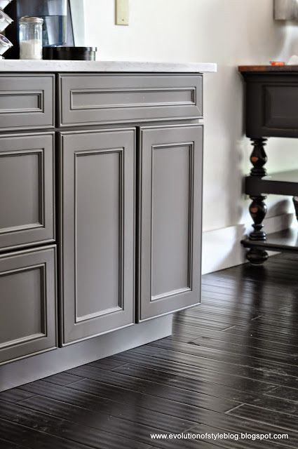 Kitchen cabinets painted dark grey Gauntlet Gray by Sherwin Williams. 