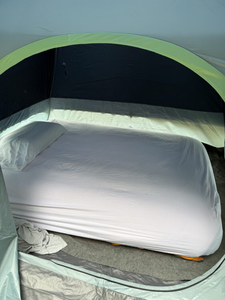 Cozy bed camping in a tent.