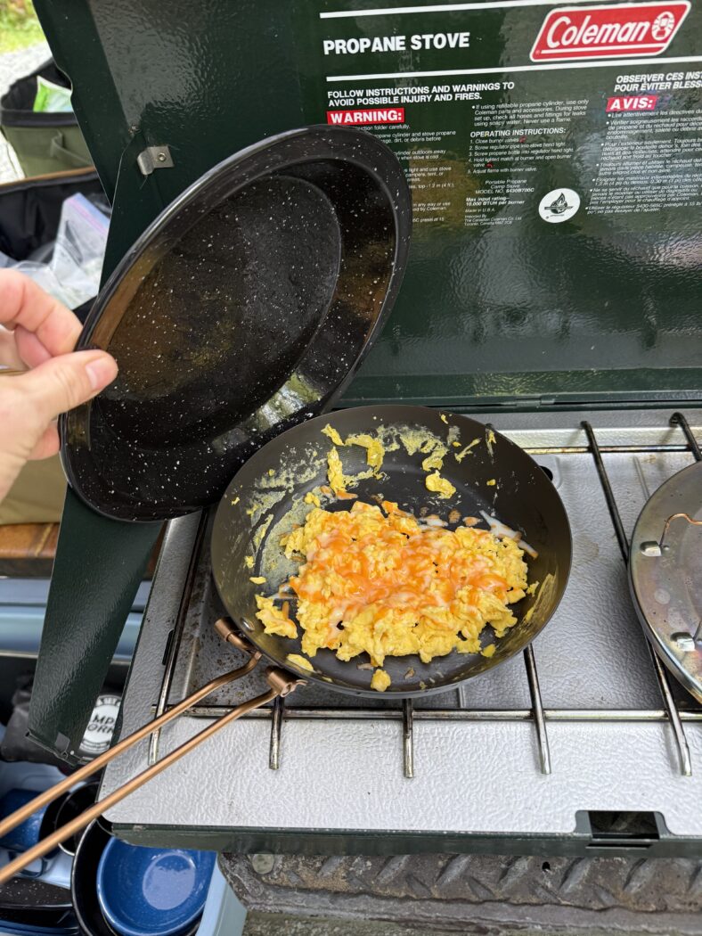 Scrambled eggs on a camp stove.